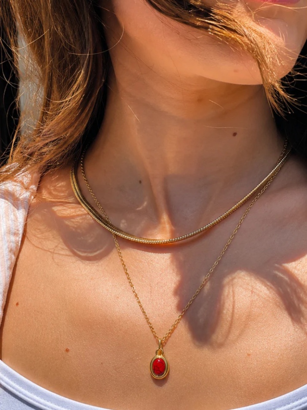 Gold Necklace with Red Oval Pendant